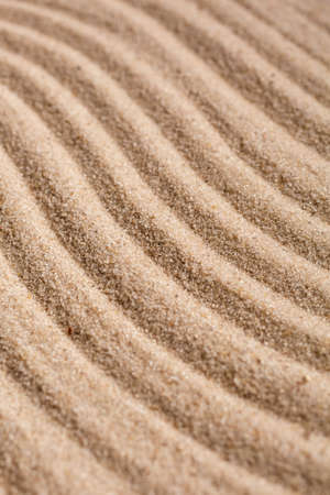 Sand Texture. Brown sand. Background from fine sand. Sand background. Waves texture.の写真素材