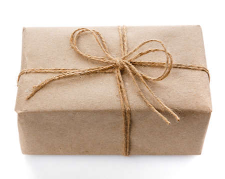 Gift craft box in natural style with burlap thread on white background.の写真素材