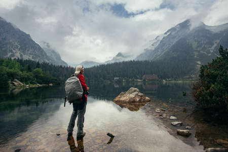 Young traveler near Lake Popradske Pleso in High Tatras The amazing nature of the High Tatra Mountains in Slovakia.の写真素材