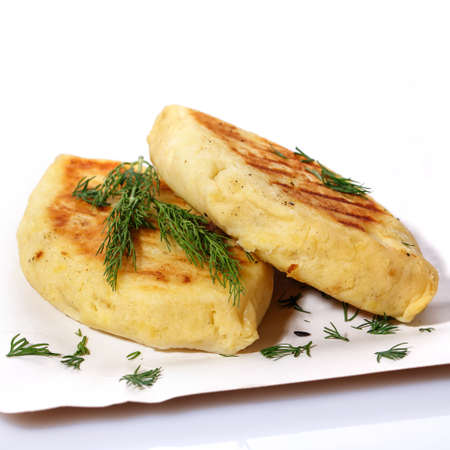 Zrazy with dill on a paper plate on a white background. National Ukrainian, Lithuanian, Polish and Belarusian cuisine. Easy meal idea.の写真素材