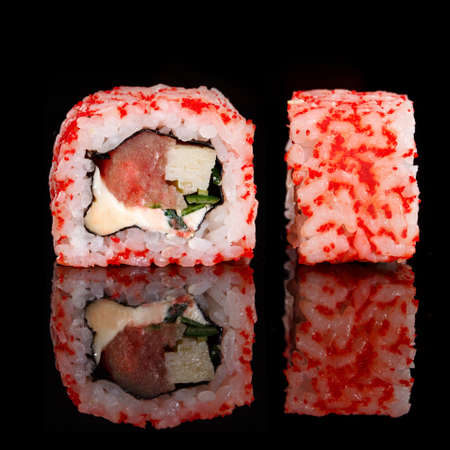 Two pieces of sushi closeup on black background. Macro shot of Japanese food.の写真素材