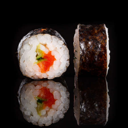 Two pieces of sushi closeup on black background. Macro shot of Japanese food.の写真素材