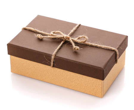 Brown gift box with linen ribbon on a white background. Gift for her husband. Gift for any holiday. Side view.の写真素材