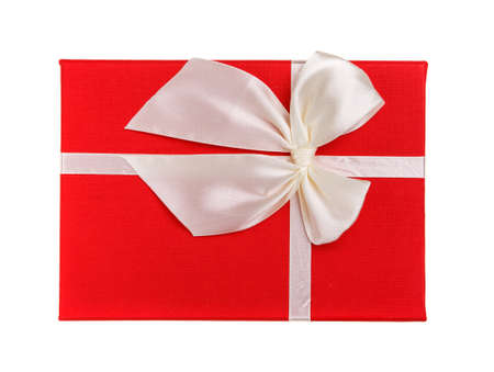 Red gift with white bow on a white background. Isolated. Top view.の写真素材