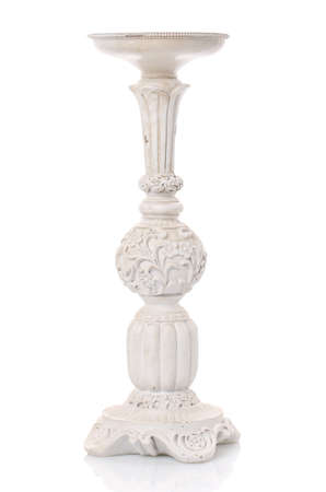 Old fashioned vintage white candlestick isolated on white background.の写真素材