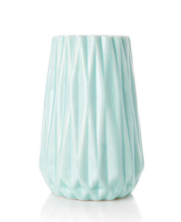 Big ribbed vase of turquoise color on a white background. Vase for flowers. Home decor.の写真素材