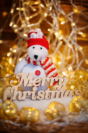 Merry Christmas greetings - text in vintage letterpress with garlands and snowmanの写真素材