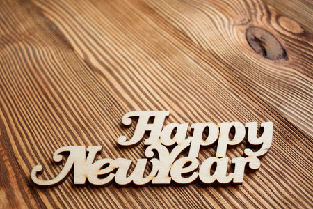 Happy new year text. Decorative wooden toyの写真素材