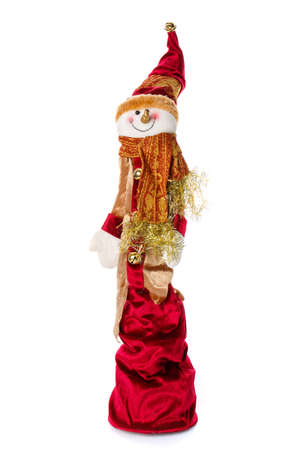 Smiling snowman toy dressed in scarf and cap. Isolatedの写真素材