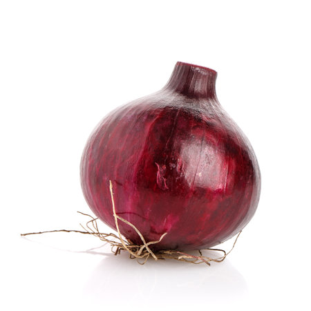Three red onion on a white background. Studio shot of vegetables.の写真素材