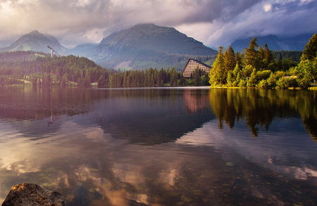 High Tatras mountains national park at sunset and Strbske pleso beautiful mountain lake in Slovakia.の写真素材