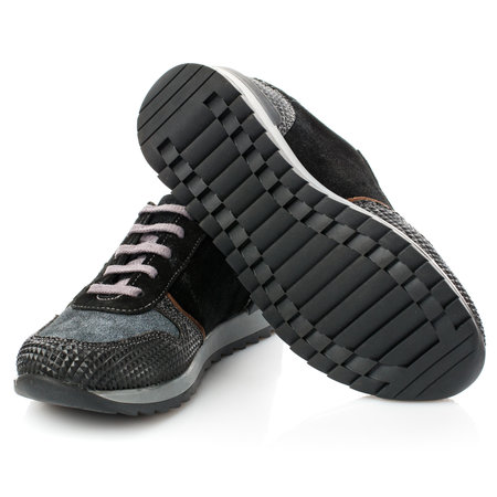 Black kid's sneakers isolated on white background. Close up.の写真素材