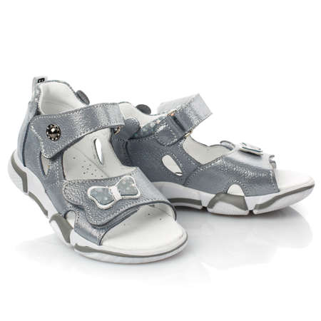 Stylish gray baby sandals for girl on white background. Close up.の写真素材