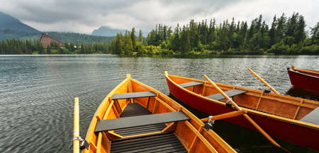 Boats at the pier on mountain lake Strbske pleso in Slovakia.の写真素材