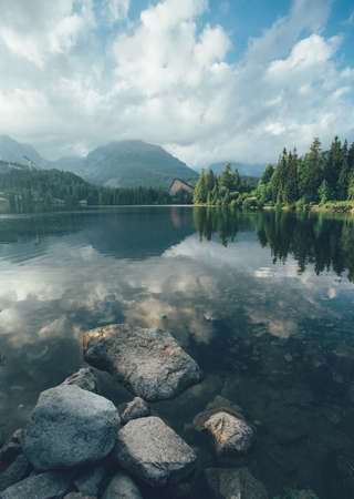Mirror Lake Strbske pleso. Landscape of the High Tatras mountains and mountain lake in Slovakia.の写真素材