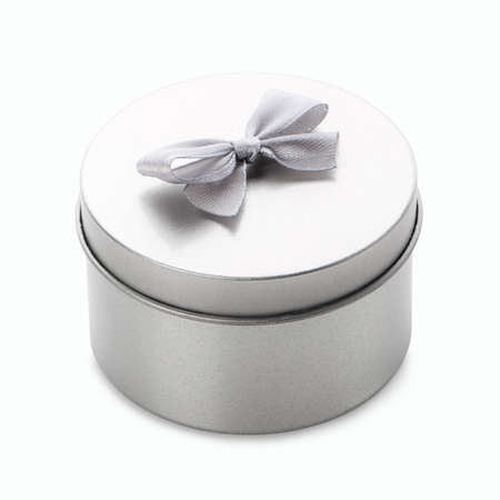 Gray round metal gift box with little gray bow on a white background.の写真素材