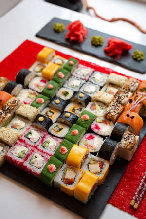 Set of sushi from many types of roles and with different stuffing. Sushi menu. Japanese gourmet sushi.の写真素材