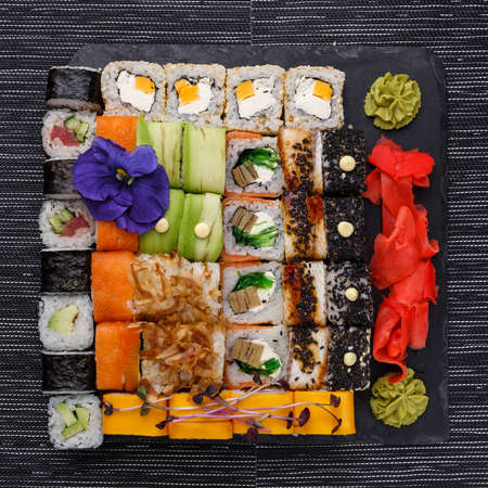 Set of sushi from many types of roles and with different stuffing. Sushi menu. Japanese gourmet sushi.の写真素材