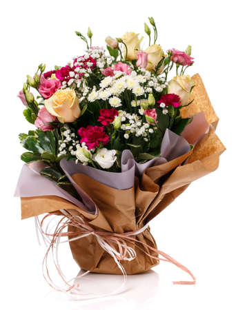 Lovely bouquet with different kind of flowers wrapped in kraft paper isolated on white. Greeting card.の写真素材