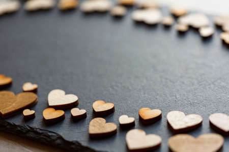 Wooden hearts in retro style as concept of love. Place for text.の写真素材