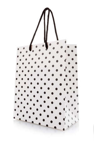 White package for shopping or gifts with black dots and handles.の写真素材