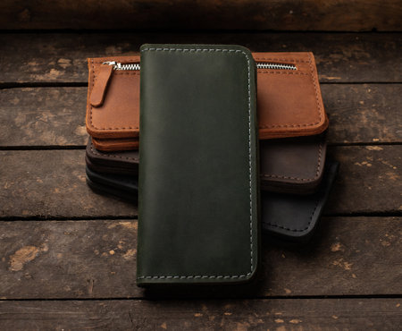 Set of stylish leather wallets on a vintage wooden background. Copy spaceの写真素材