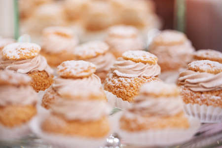 Fresh, appetizing, sweet, modern desserts close up on a decorated festive buffet tableの写真素材