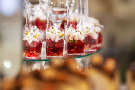 Fresh, appetizing, sweet, desserts close up on a decorated festive buffet tableの写真素材