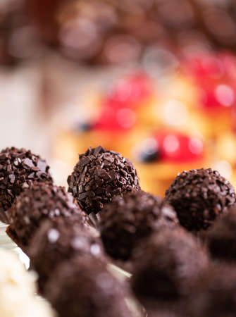 Fresh, appetizing, sweet, modern desserts close up on a decorated festive buffet tableの写真素材