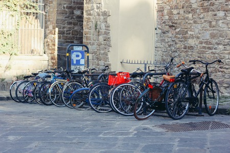 Bicycle parking on the background of the cityscape of Florence, Italyの写真素材