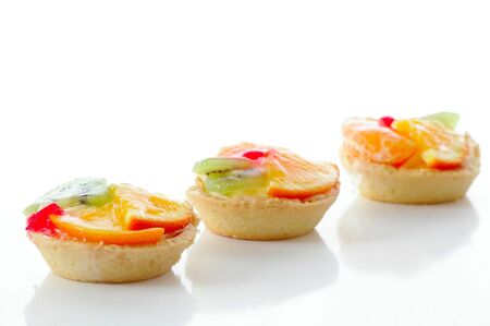 Several fruit pastry against the white backgroundの写真素材