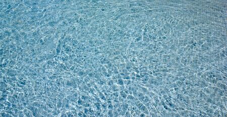Solar highlights on water in pool abstract backgroundの写真素材