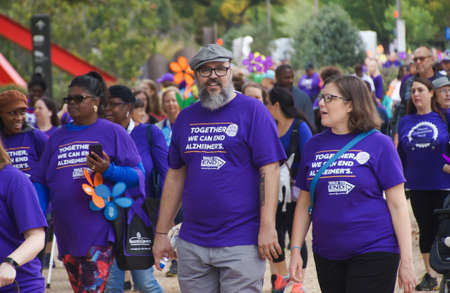 Washington, DC / USA - October 14 2017 - People marching against Alzheimer's. Walk to stop Alzheimer's in Washington DC. Purple color.のeditorial素材
