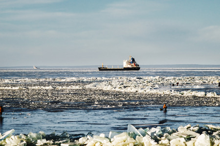 winter fishing on the sea the bright sunの写真素材