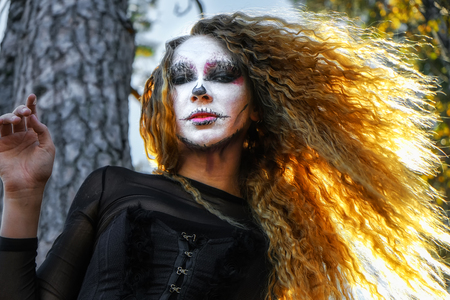 zombie girl with black eyes and bloody mouthの写真素材