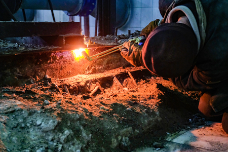 the welder welds metal structures