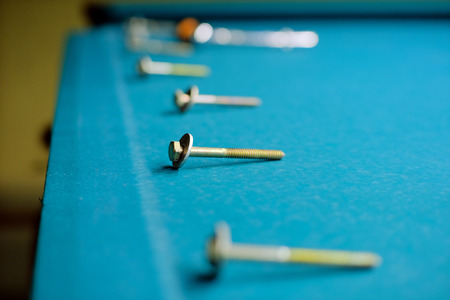 the bolts are on the felt pool table