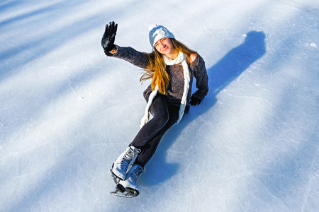 young beautiful girl ice skatingの写真素材