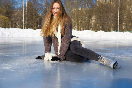 young beautiful girl ice skatingの写真素材