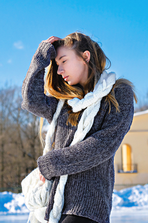 winter portrait of a young beautiful girlの写真素材