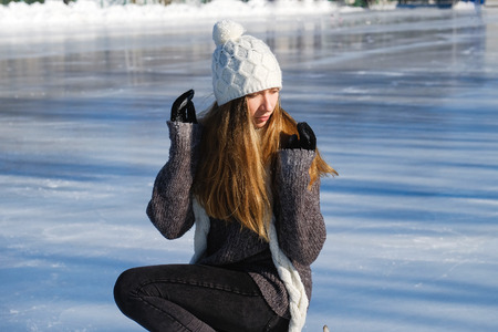 young beautiful girl ice skatingの写真素材