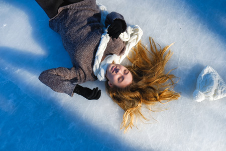 young beautiful girl ice skatingの写真素材