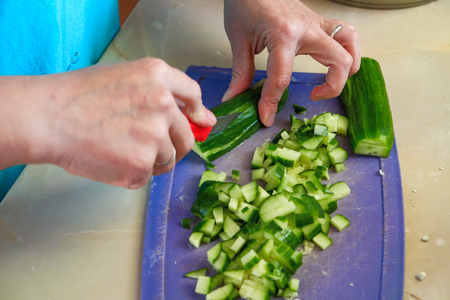the chef cuts green saladの写真素材
