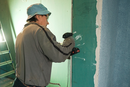 worker making repairs in a country houseの写真素材