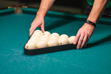 billiard balls collected in the figure on the tableの写真素材