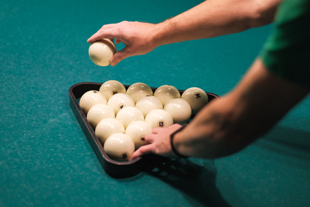 billiard balls collected in the figure on the tableの写真素材