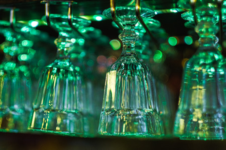 beautiful crystal glasses hanging in the bar