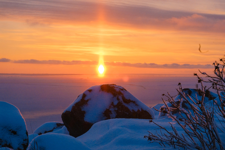 the magical colorful sunset on the winter seaの写真素材