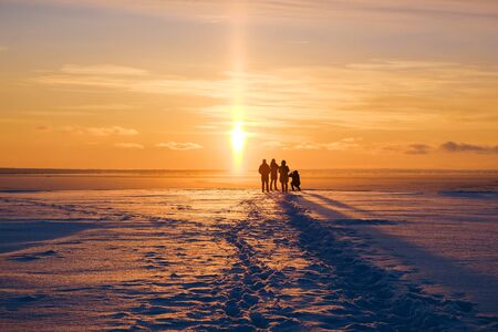 the magical colorful sunset on the winter seaの写真素材