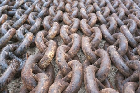 the anchor chain is in the dockの写真素材